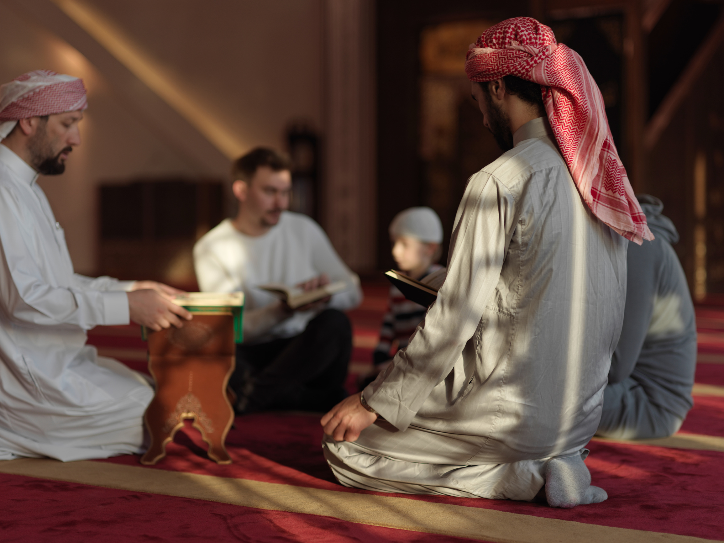 Muslim People in Mosque Reading Quran Together